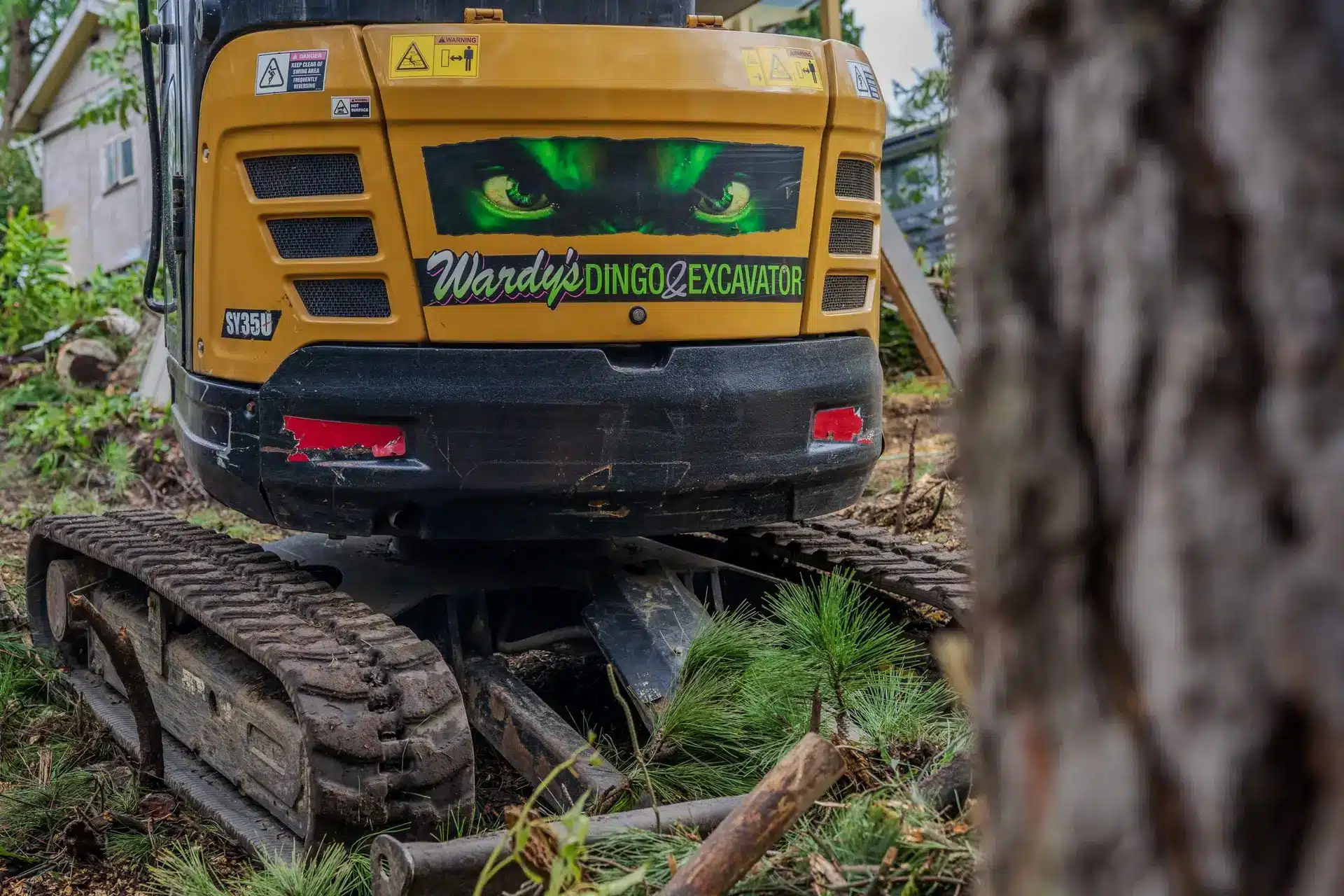 Arbtec excavator working between trees
